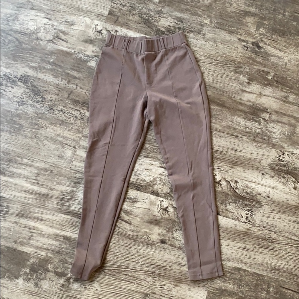 Stretch trousers with pleats